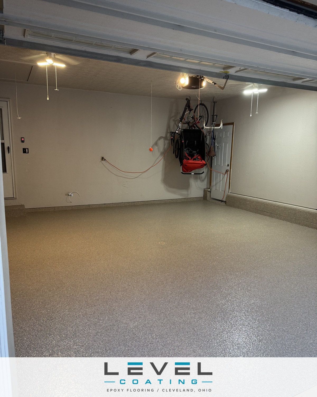 Two-car garage after a Level Coating flake floor install - Broadview Heights, OH