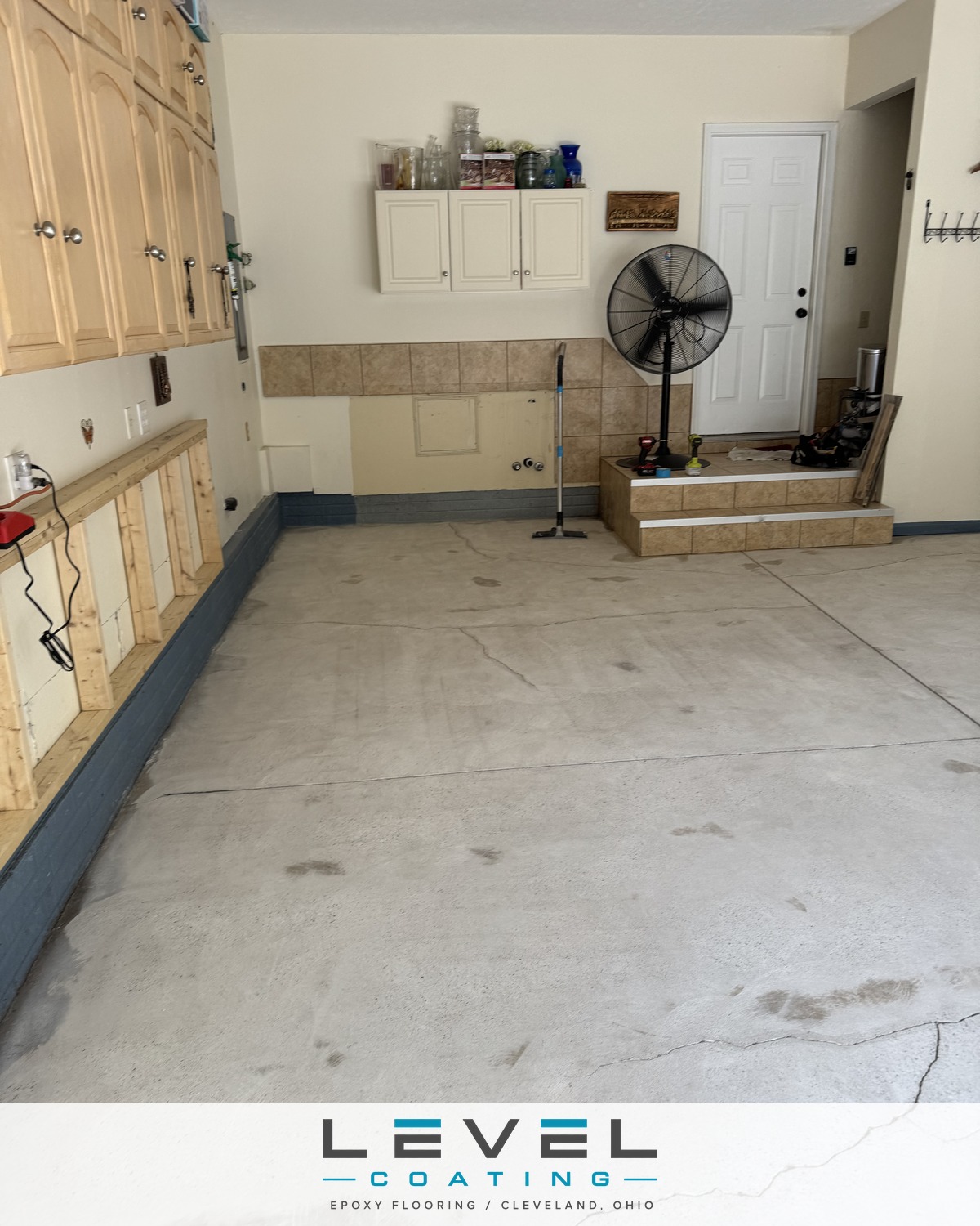 Cracked, oil-stained concrete garage floor before coating - North Ridgeville, OH
