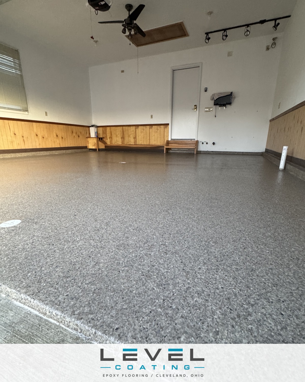 Two-car garage after a Level Coating polyaspartic flake floor - North Royalton, OH